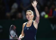 SINGAPORE - OCTOBER 23:  Simona Halep of Romania celebrates victory in her singles match against Madison Keys of the United States during day 1 of the BNP Paribas WTA Finals Singapore at Singapore Sports Hub on October 23, 2016 in Singapore.  (Photo by Julian Finney/Getty Images)